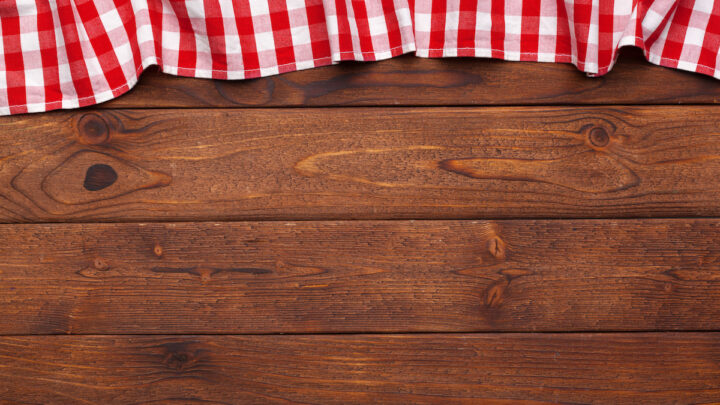 checkered table cloth on wooden table