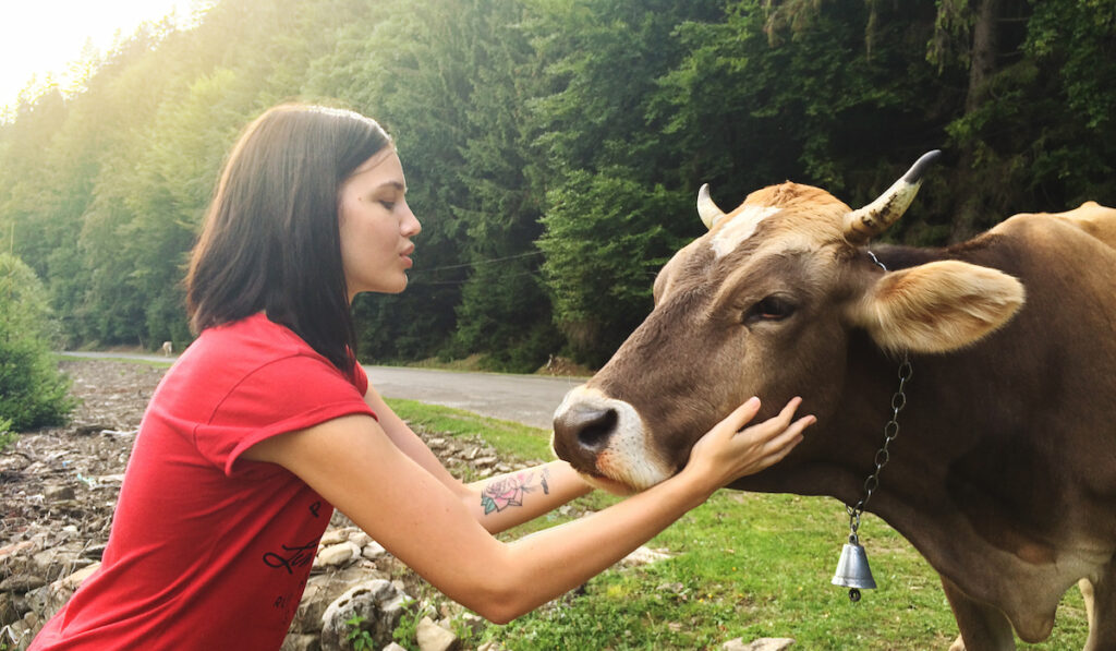girl holding cow head