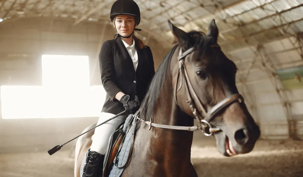 horse rider wearing helment