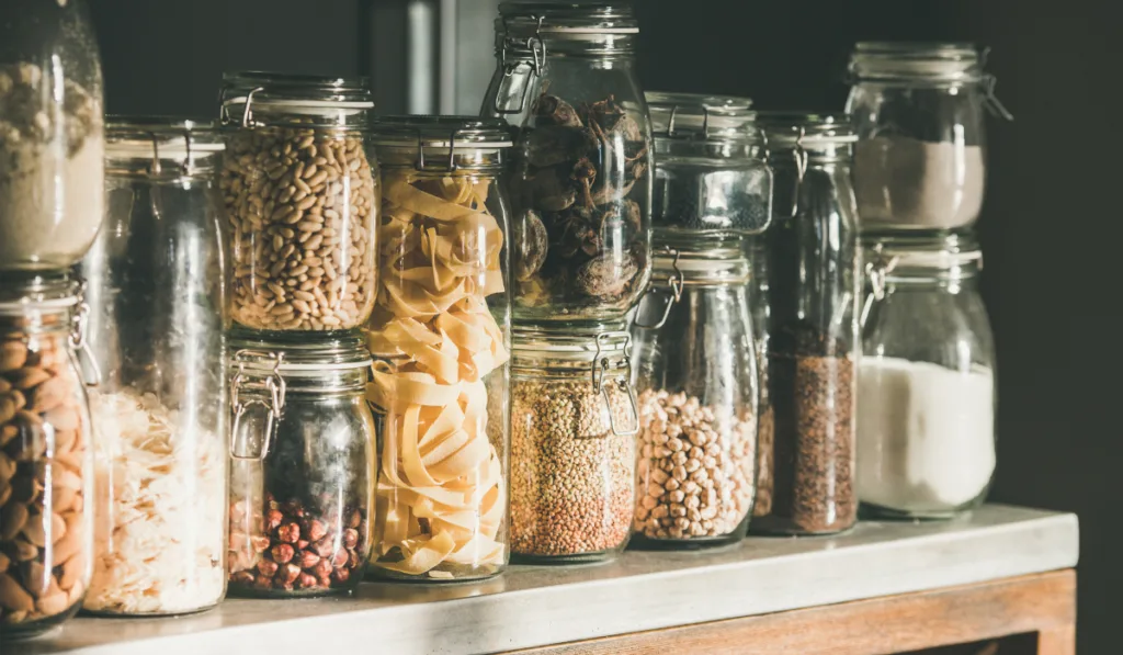 Rustic kitchen food storage arrangement over kitchen counter ee220327