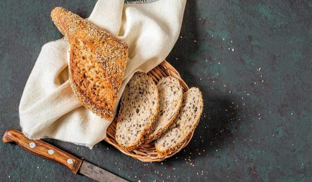 whole wheat bread with flaxseeds on a basket - ee220320