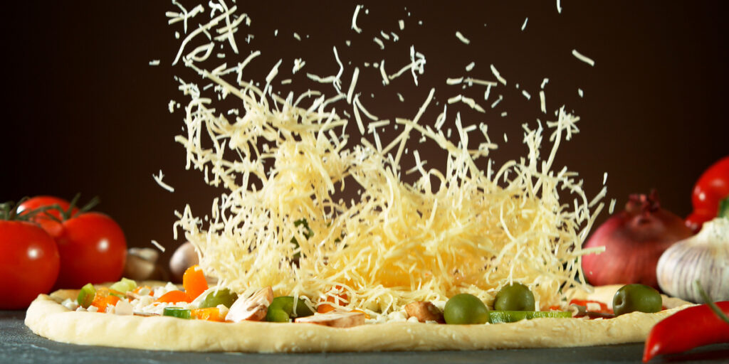 Falling mozzarella cheese on pizza