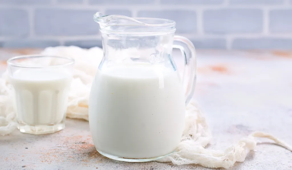 a jar and glass of milk