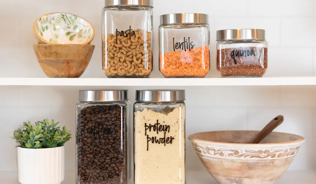 Neatly labeled food ingredients on the kitchen shelf 