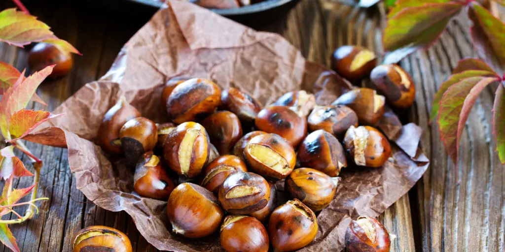 Roasted chestnuts on an old board