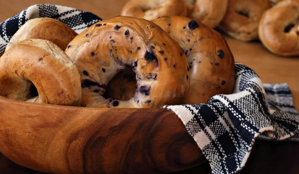 blueberry, whole wheat, and cinnamon) in wooden bowl with handwoven cloth