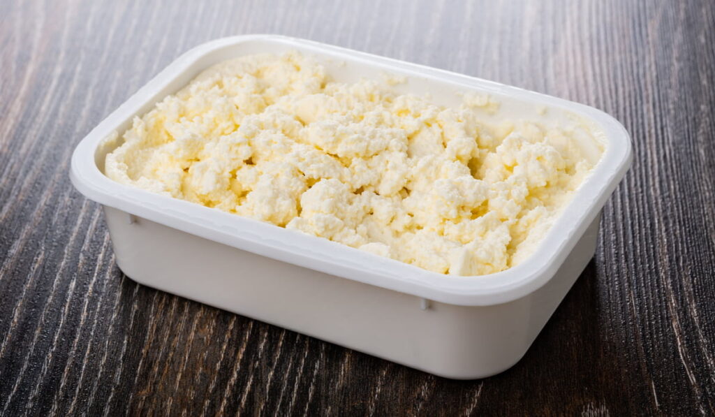 cheese in a white container for storage