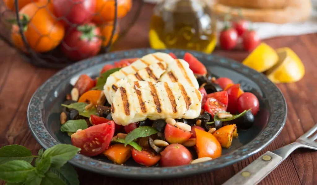 fresh salad with Halloumi cheese on top