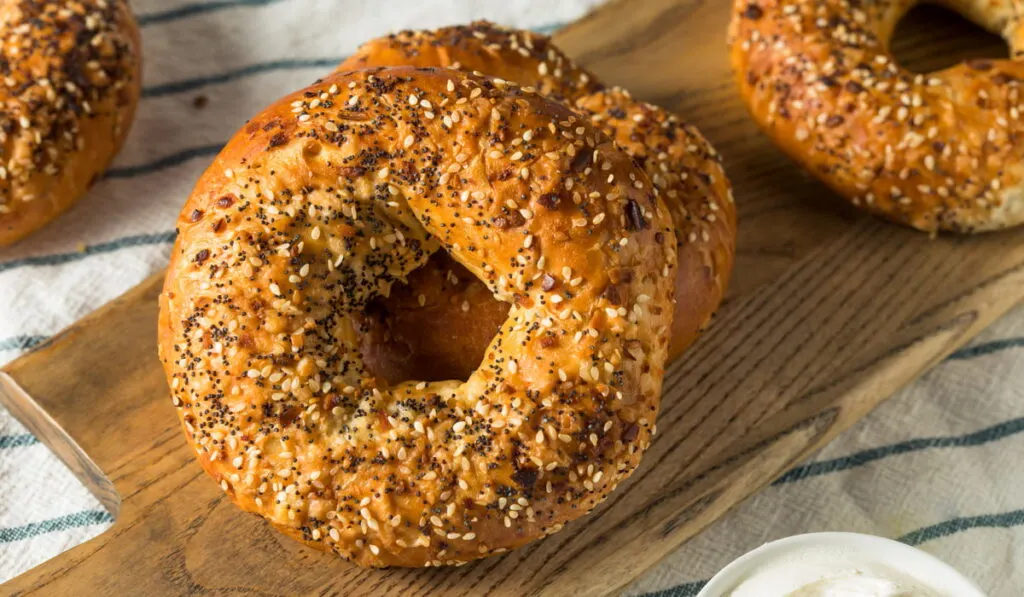 freshly baked Everything Bagel on a wooden board