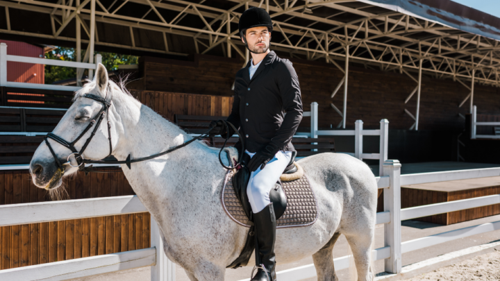 handsome-male-equestrian-riding-white-horse-ee220401