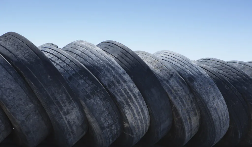 A row of discarded rubber tires
