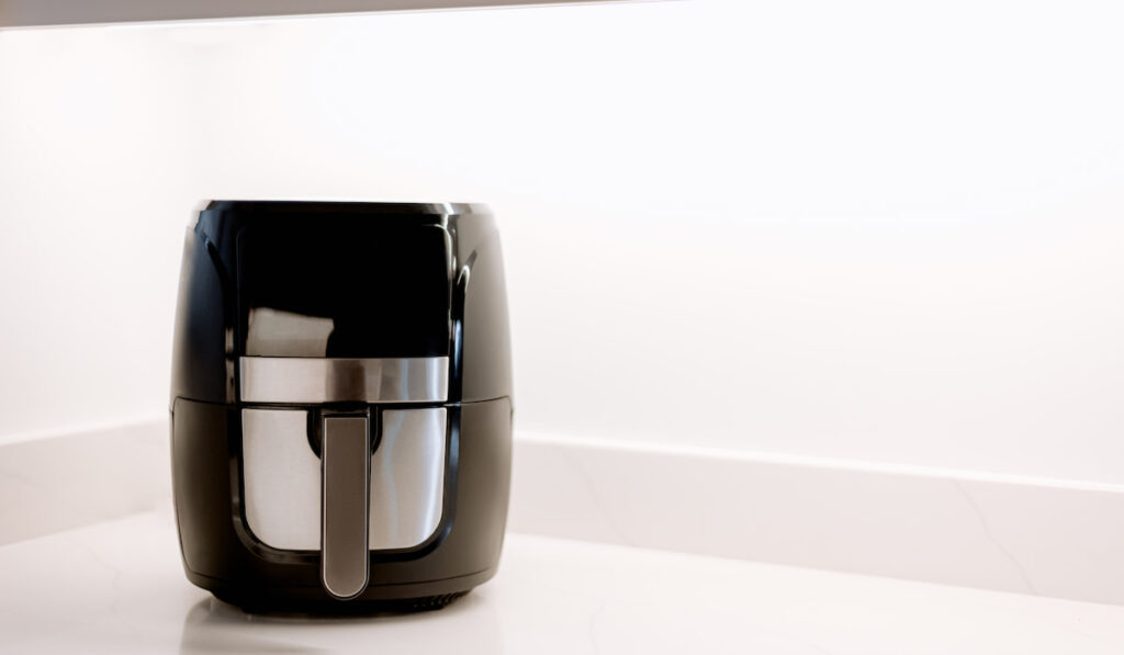 Air fryer on the worktop white background 
