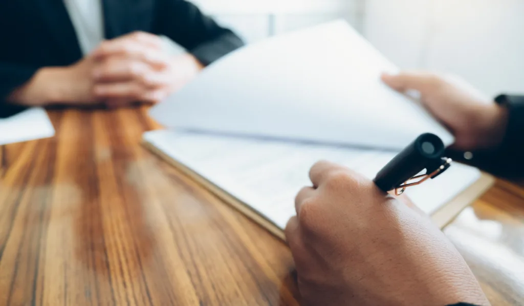 Business people negotiating a contract