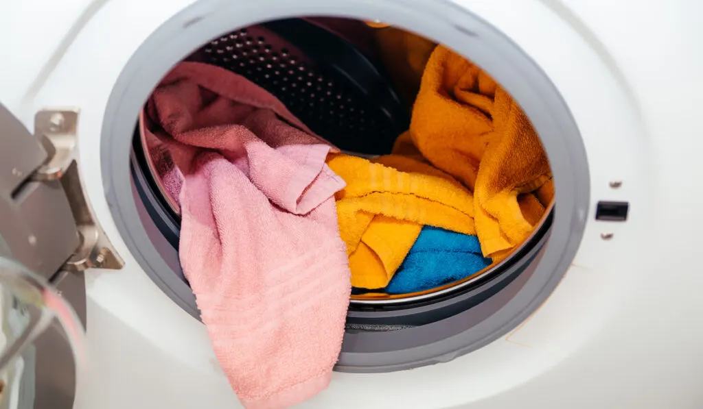 Colored towels in an open washing ma