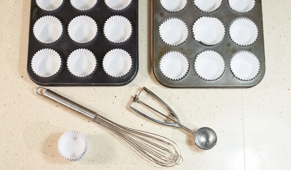 Cupcake baking pans near tools 