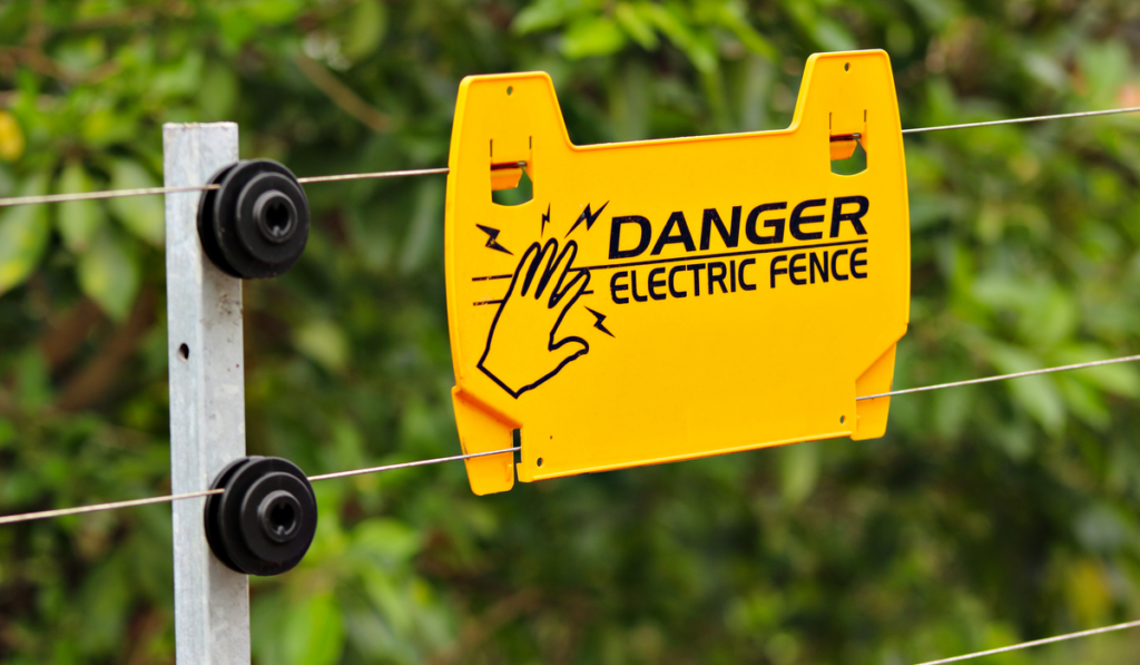 Electric safety fence with danger sign