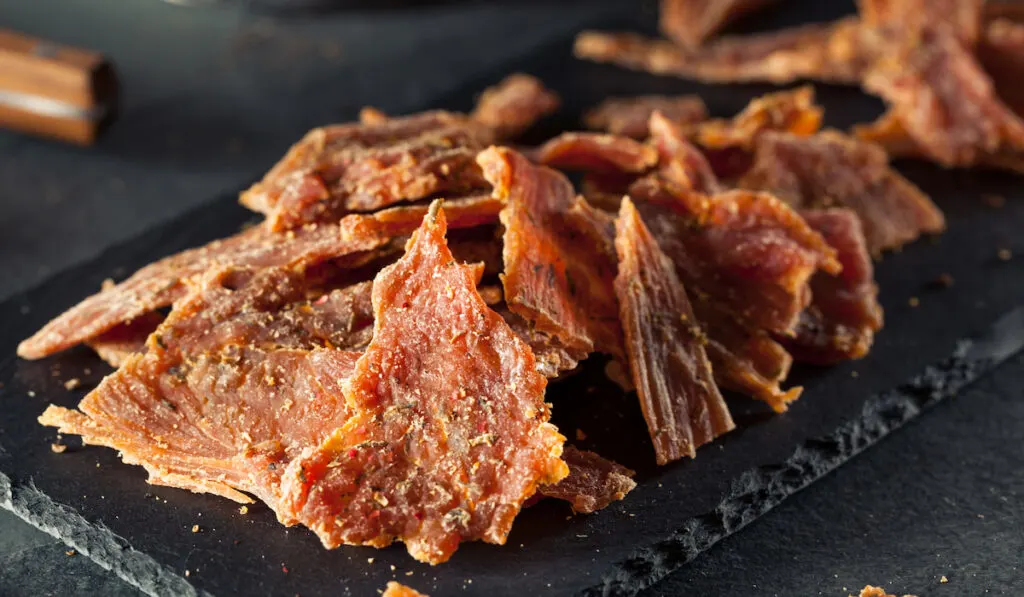 Healthy Dry Turkey Jerky on black background