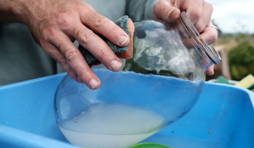 man cleaning the jar