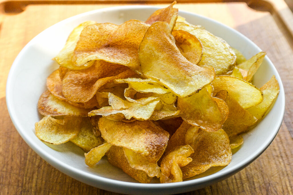 Potato chips in white bowl 