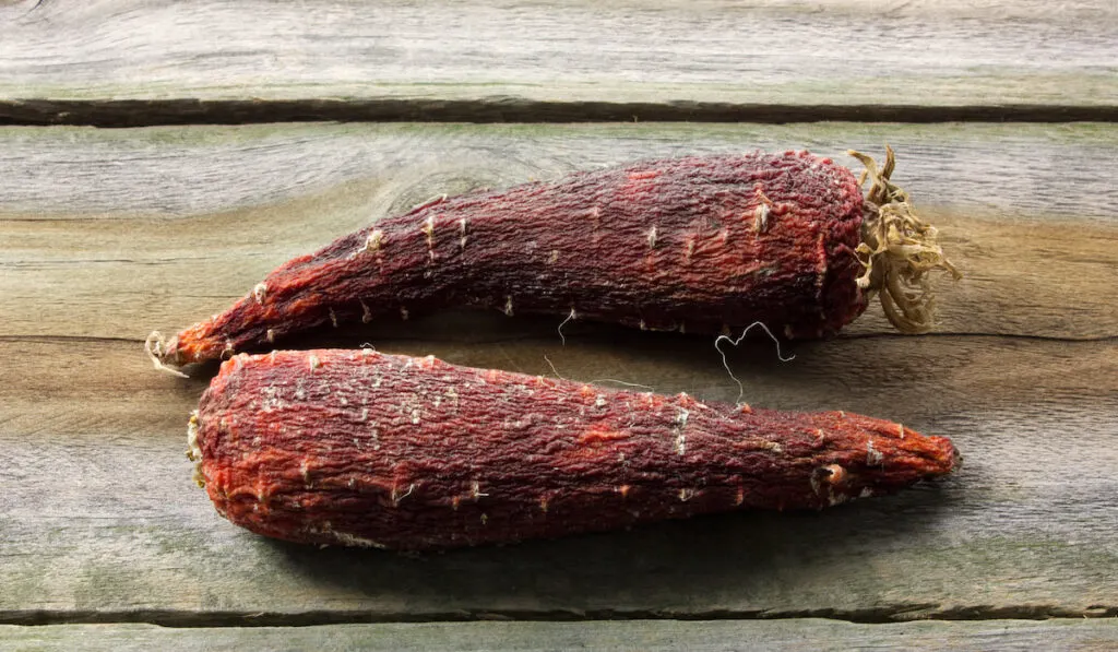 Rotten Carrots on wooden table