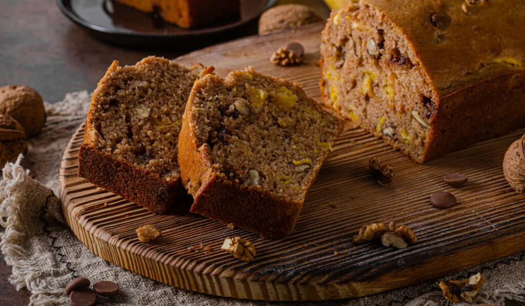 Sweet and heathy banana bread on wooden chopboard