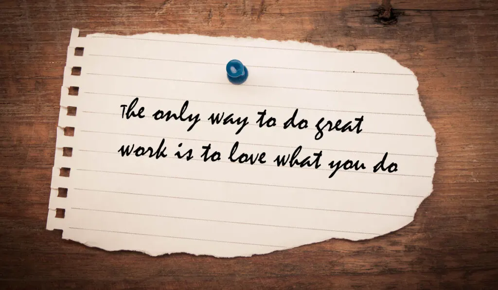 The only way to do great work is to love what you do sign on paper