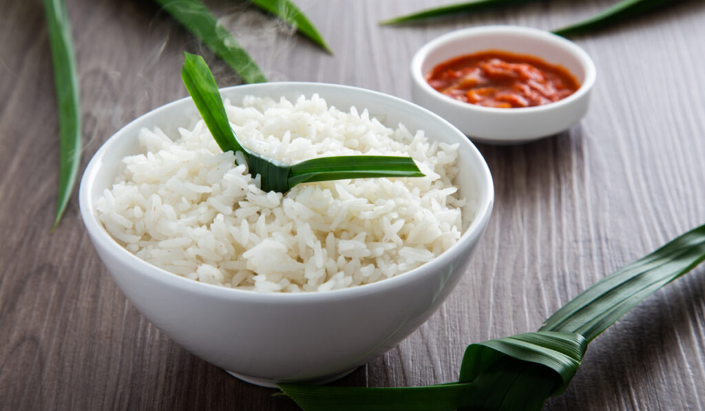 cooked rice with Aromatic Pandan on wooden background
