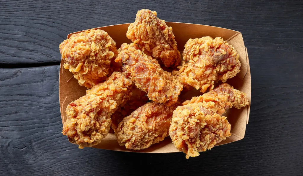 crispy fried chicken on black background 