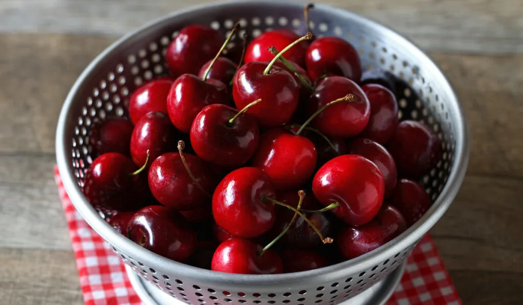 fresh cherries on wooden table