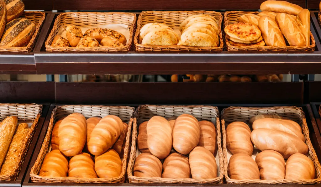 freshly baked various bread in pastry department of grocery store
