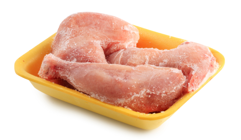 frozen chicken meat on a white background
