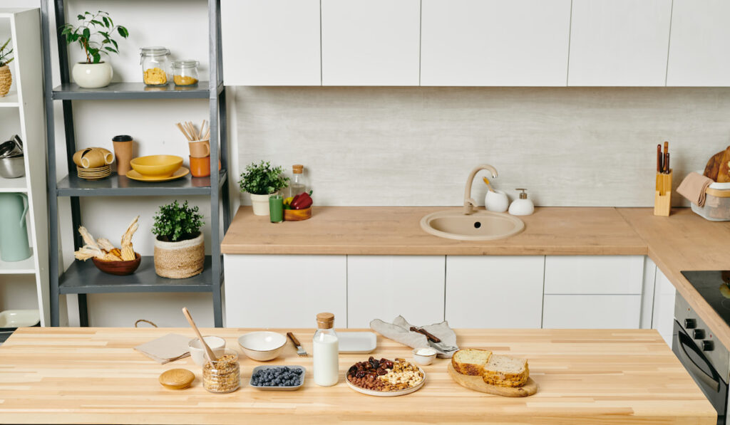 kitchen design pantry shelves food on table and oven on the side 