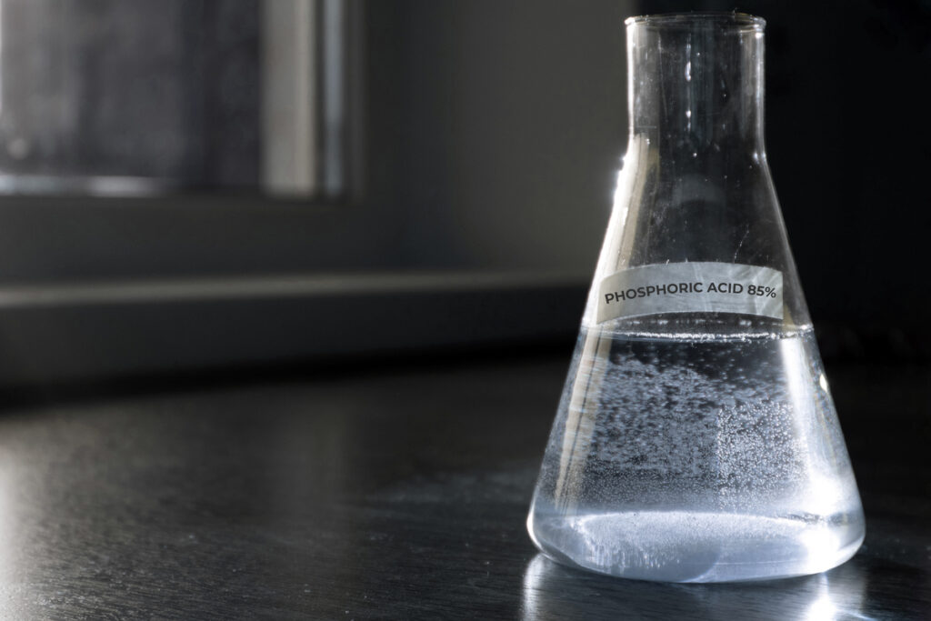 phosphoric acid in a glass on black table