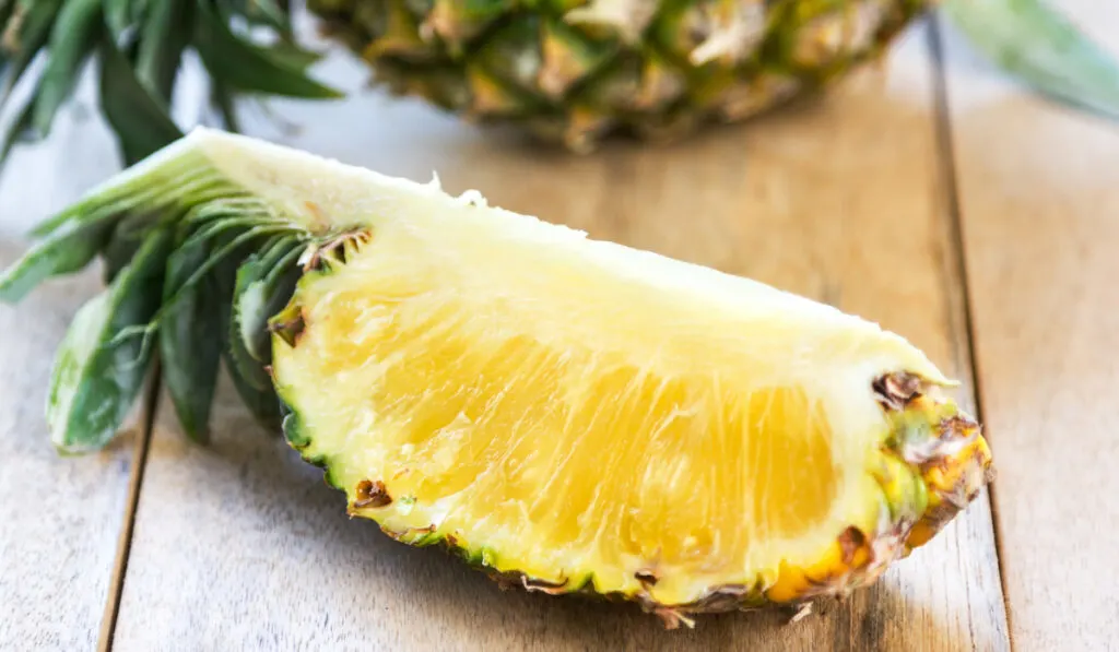 sliced Pineapple on wooden table