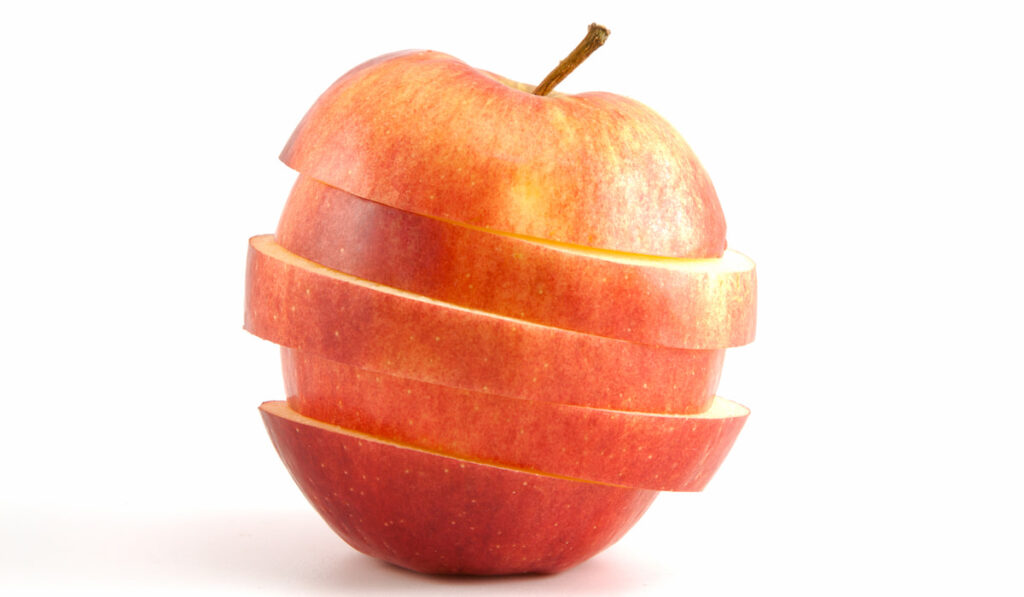 sliced red apple on white background