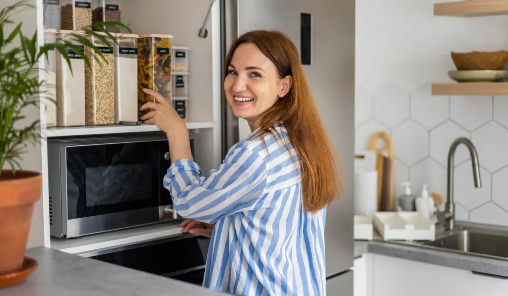 tidying up in cupboard kitchen