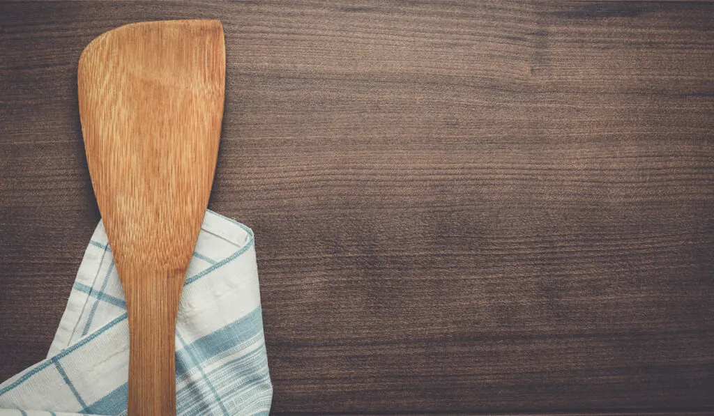 wooden spatula on the brown table