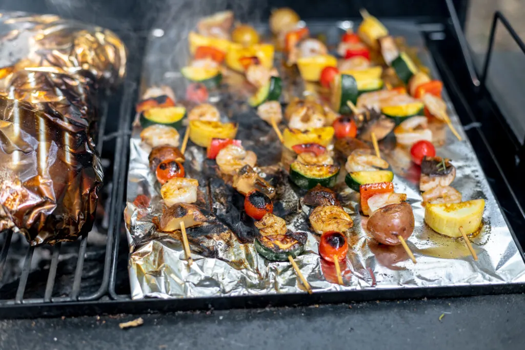 shrimp and veggies skewers almost done grilling