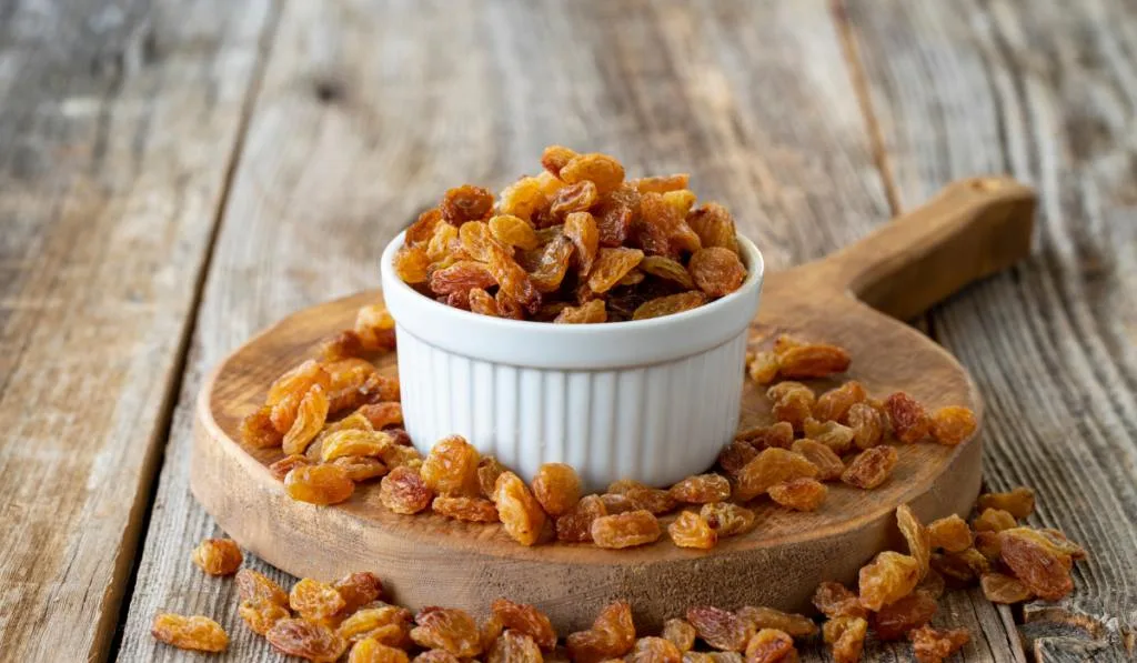  Dry raisins nuts on wood floor