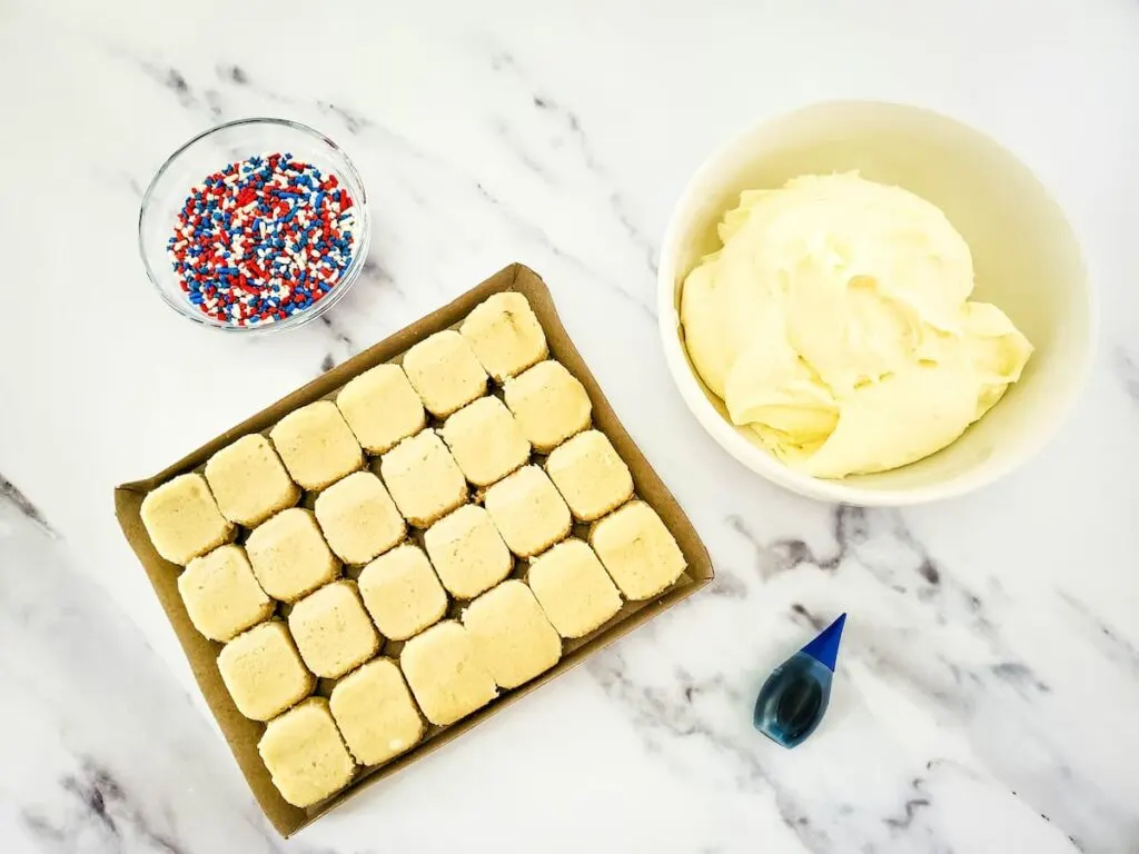 sugar cookie ingredients laid out on a marble table