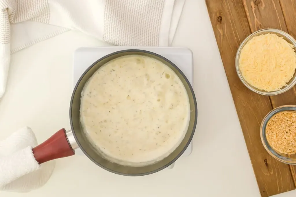 Alfredo sauce in pan