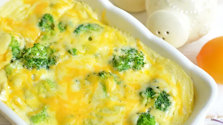 Freshly-cooked-Keto-Low-Carb-Breakfast-Casserole-on-a-wooden-table-with-two-salt-dispenser-on-the-side
