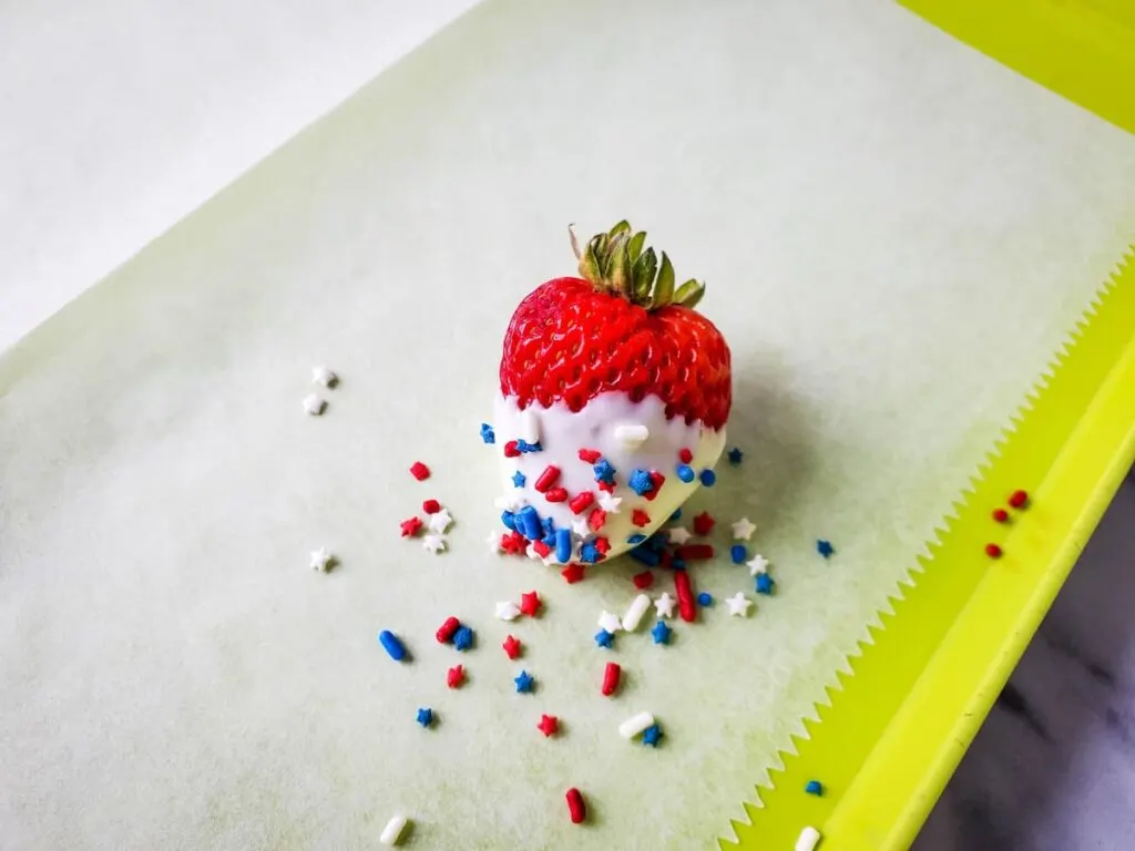 dipped strawberry with sprinkles on top  