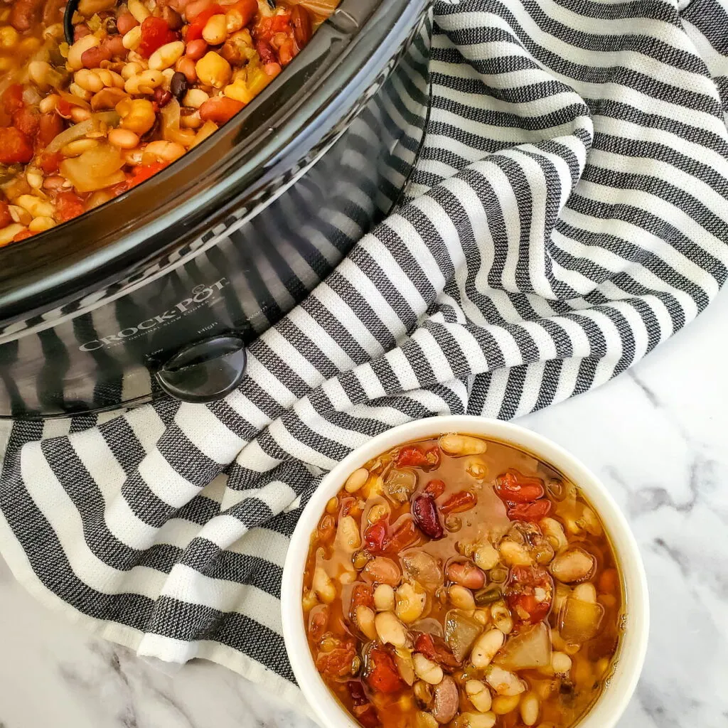  Vegan Bean Soup in a crokpot container and white bowl