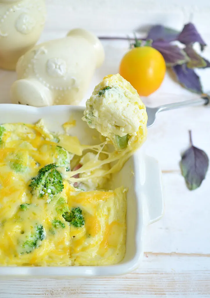 forked small portion of Freshly cooked Keto Low Carb Breakfast Casserole on a wooden table