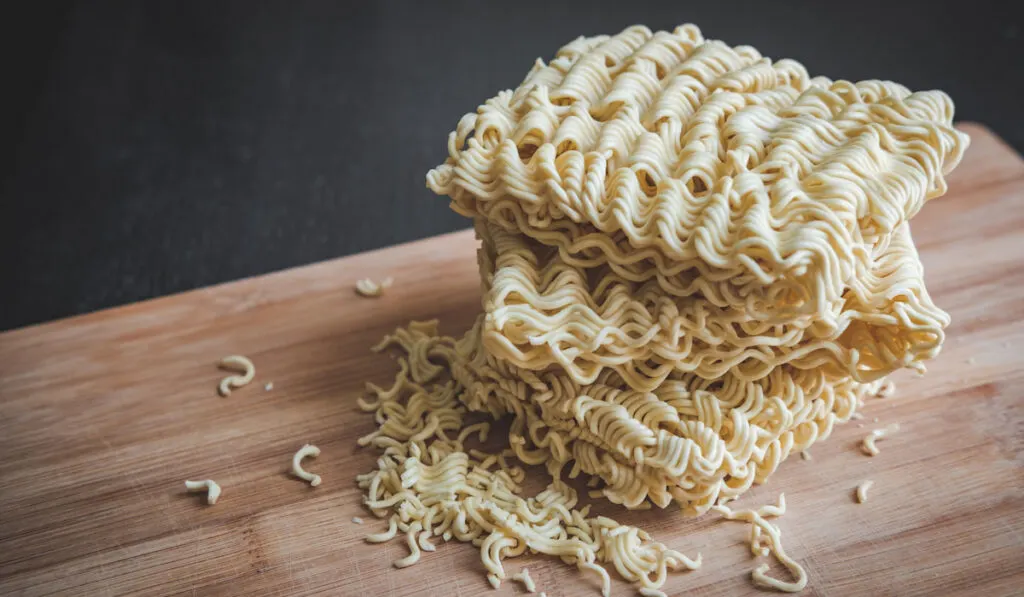 A stack of instant noodle on wood background
