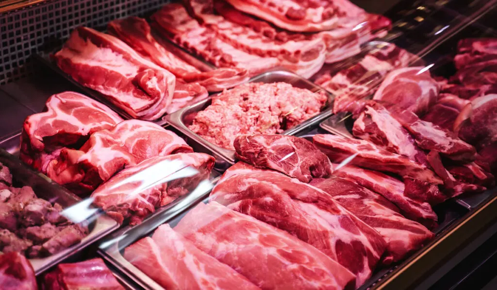  Fresh red and raw meat in a meat grocery shop