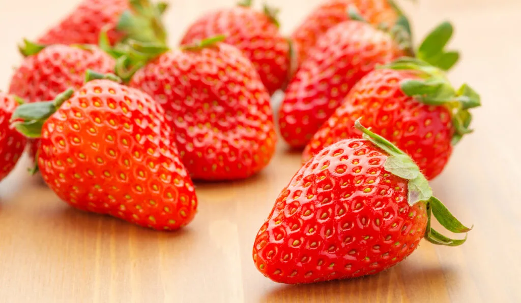 Heap of strawberry on wooden table