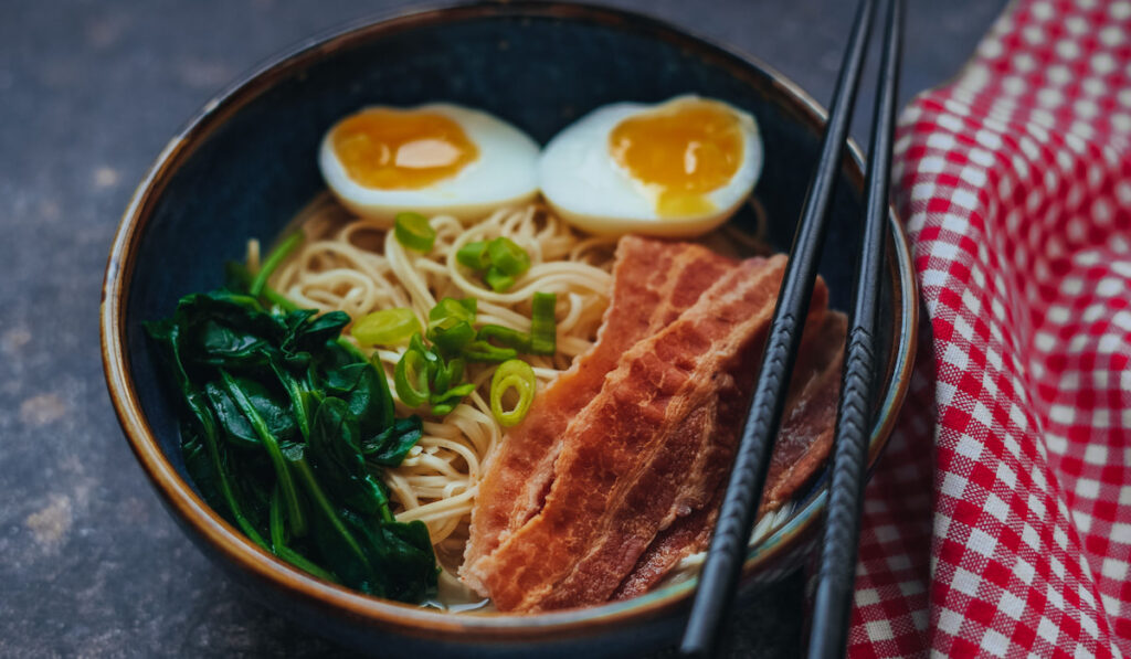 Homemade ramen noodles with spinach and bacon
