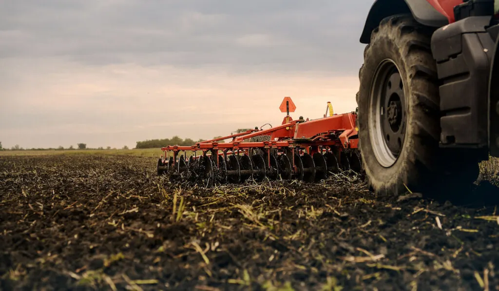 Land cultivation process on a farm using a cultivator